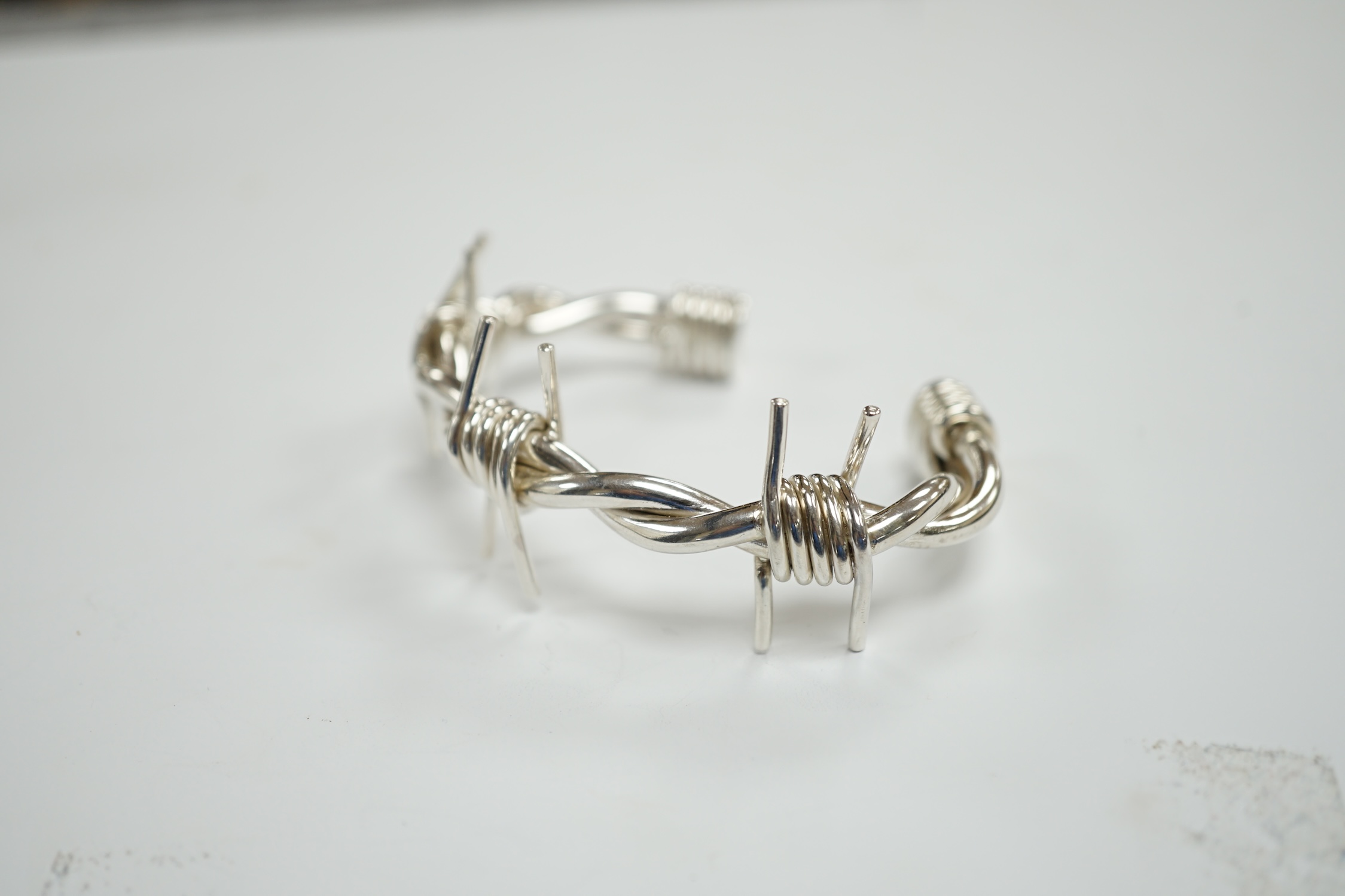 A modern silver 'barbed wire' open bangle, by M. Marlow, Edinburgh, 2006, overall width 83mm, 74 grams.